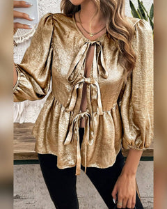 BLUSA BRILLO MANGA 3/4 ATADA